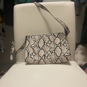 Urban outfitter purse. Great snakeskin in neutral colors.